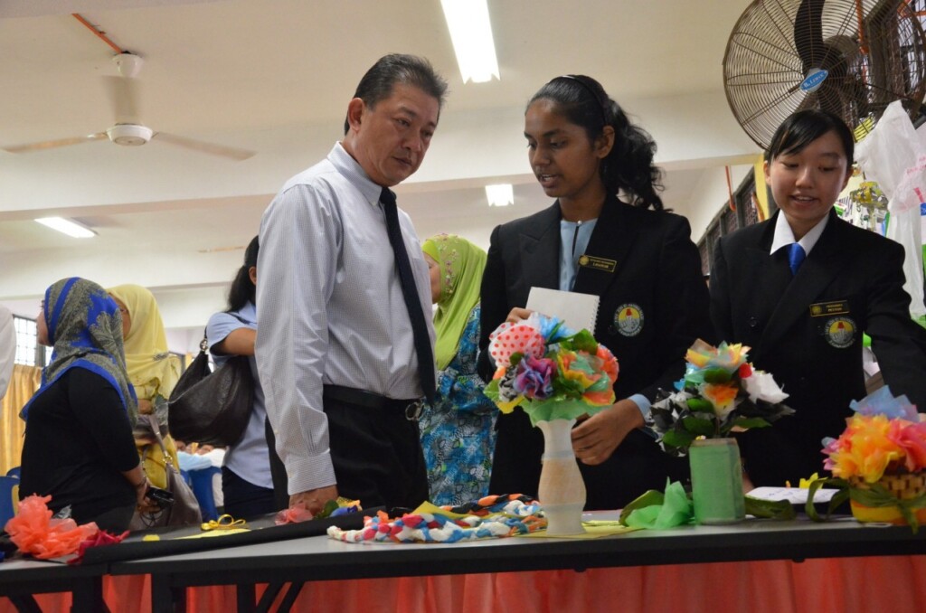 Shamsor Mohd Zain, Director of Marketing, UMW Toyota Motor listening to the students during the onsite presentation from SMK Zon R1 Wangsa Maju, Kuala Lumpur