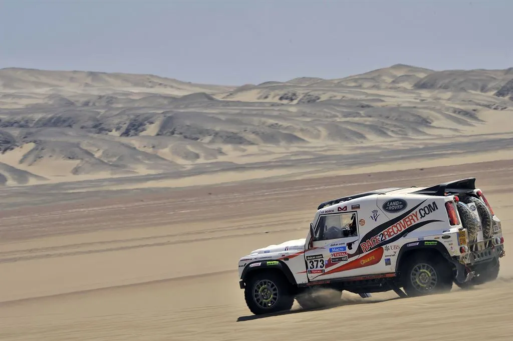 The Race2Recovery team pictured competing on a desert stage in Dakar rally in 2013