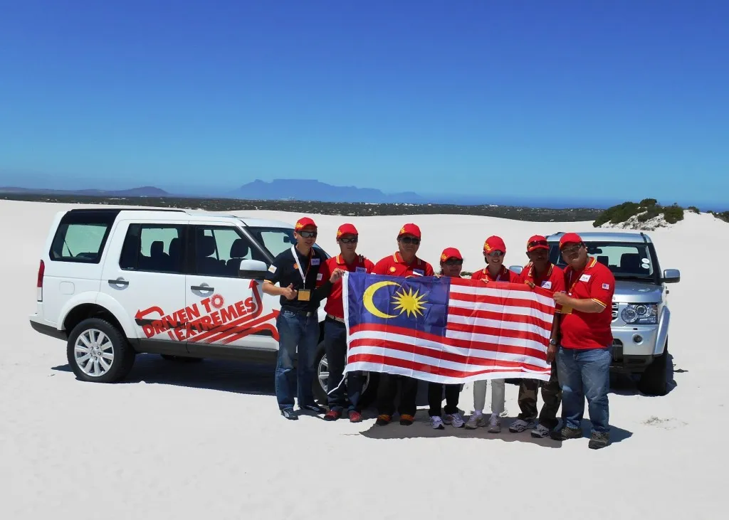 Shell Lubricants Cluster Marketing Manager Alex Lim (L) with the Malaysian participants in South Africa during the Shell Helix Driven to Extremes World Championship