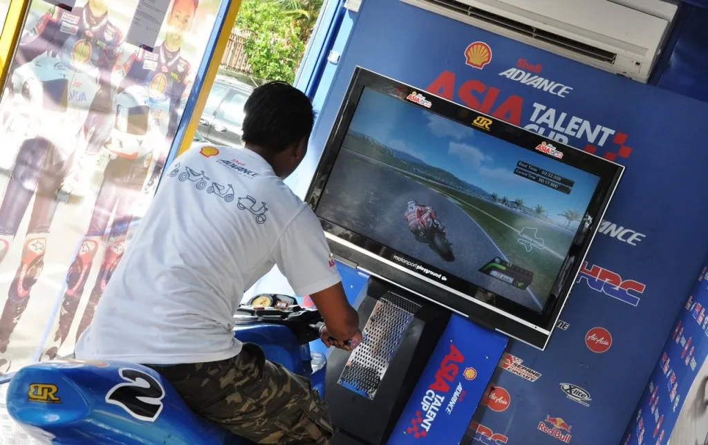 A visitor trying out the bike simulator on the Shell Advance On Wheels Truck at a previous roadshow