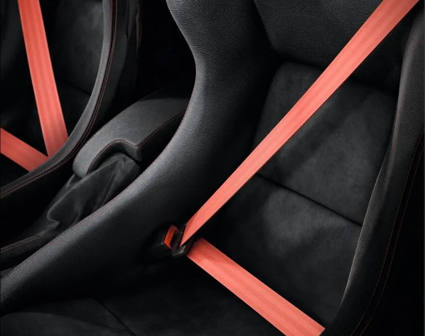 Recaro Pôle Position polycarbonate monocoque seats fitted with a threepoint seat belt and a sixpoint harness with aviation style buckle