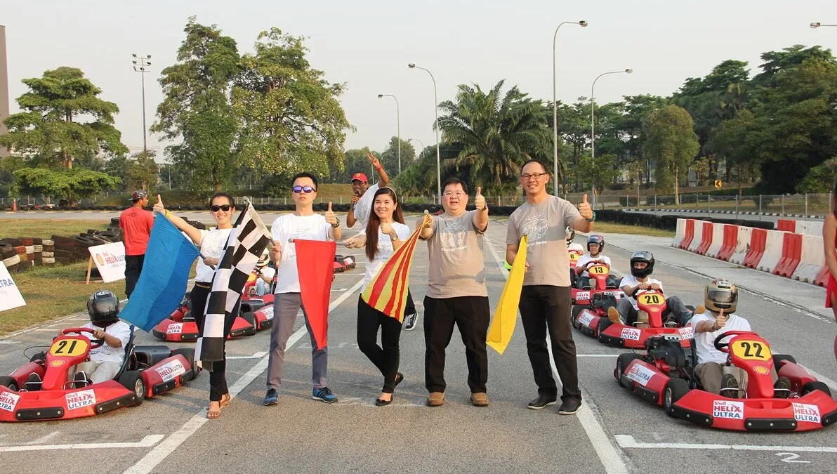 The Shell Lubricants team pose with the 10 contest finalists prior to the flag-off