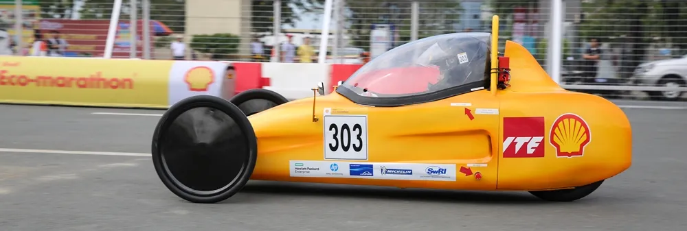 The EcoTraveller, #303, a battery electric prototype vehicle from team EcoTraveller at the Institute of Technical Education (ITE) in Singapore, is on the track at the opening ceremony during day two of the Shell Eco-marathon Asia, in Manila, Philippines, Friday, March 4, 2016. (Kay Edwards/AP Images for Shell)