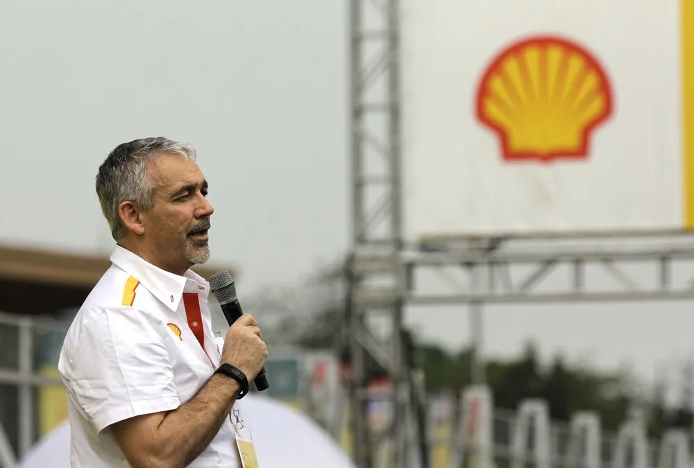 Simon Henry, Chief Financial Officer of Royal Dutch Shell, left, speaking during the opening ceremony on day two of the Shell Eco-marathon Asia in Manila, Philippines, Friday, March 4, 2016. (Geloy Concepcion via AP Images)
