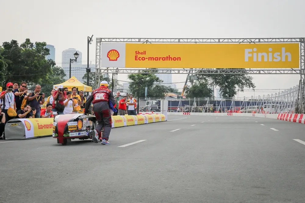 The El Krudo 4, #54, a diesel prototype vehicle from Team Lahutay 4 at the University of San Carlos in Cebu City, Philippines, is on the track at the opening ceremony during day two of the Shell Eco-marathon Asia, in Manila, Philippines, Friday, March 4, 2016. (Kay Edwards/AP Images for Shell)