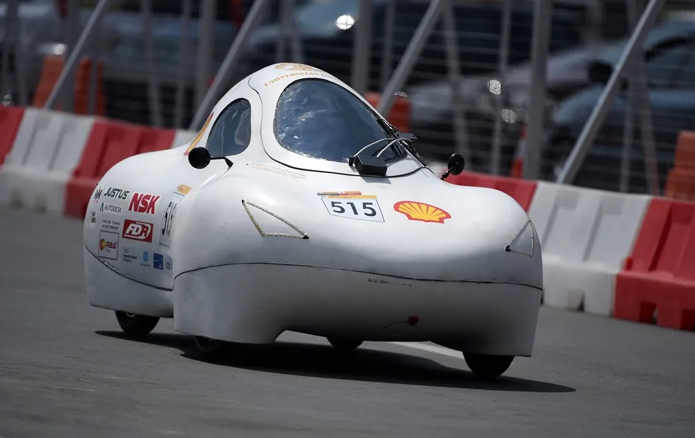 The Kalabia Evo 5, #515, a gasoline UrbanConcept vehicle from team Sadewa at the Universitas Indonesia in Depok, Indonesia, comes near a turn on the track during day three of the Shell Eco-marathon Asia in Manila, Philippines, Saturday, March 5, 2016. (Jinggo Montenejo  via AP Images)