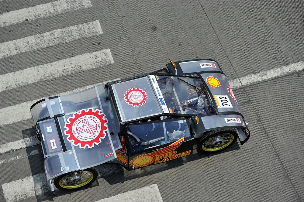 The Dagitab, #702, a battery electric UrbanConcept vehicle from team tup lawin2 at the Technological University of the Philippines-Manila in Manila, Philippines, runs on the track during the final day of the Shell Eco-marathon Asia in Manila, Philippines, Sunday, March 6, 2016. (Jinggo Montenejo  via AP Images)