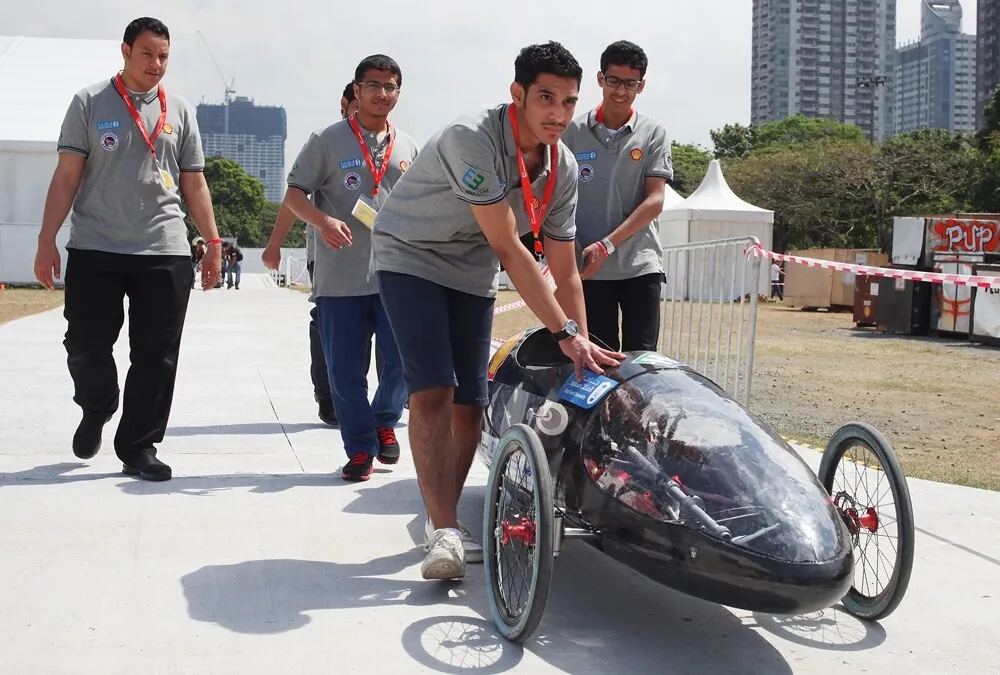 The Viper, #309, a battery electric prototype vehicle from team KSUEECar at the King Saud University in Riyadh , Saudi Arabia,  is pushed into position for a group portrait during day one of the Shell Eco-marathon Asia, in Manila, Philippines, Thursday, March 3, 2016. (Nacho Hernandez for Shell via AP Images)