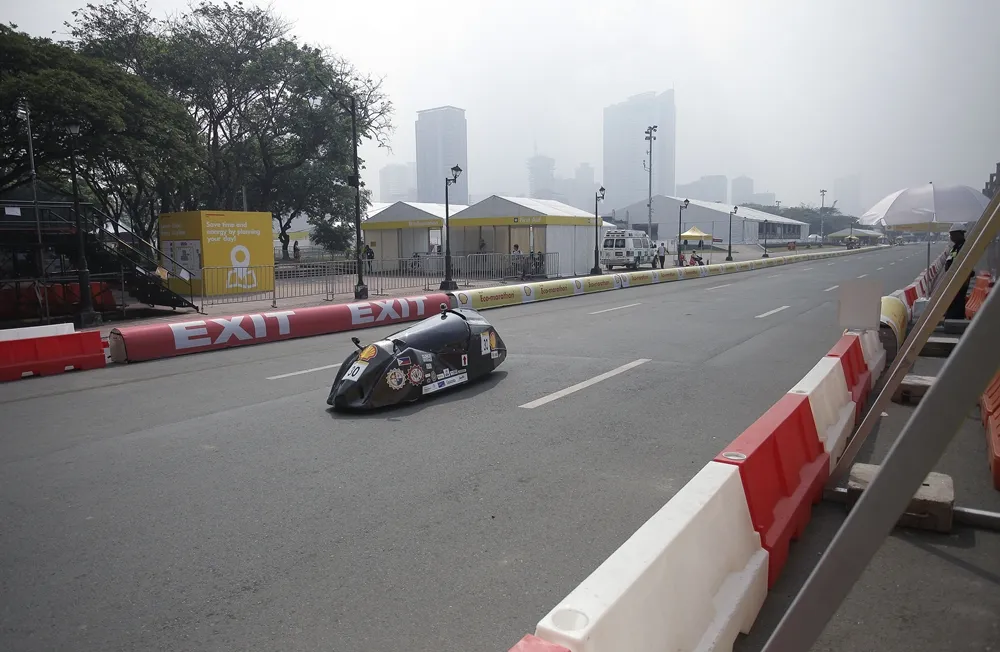 The SULO 2.0, #30, a gasoline prototype vehicle from Team PLM ISKOLARS at the Pamantasan ng Lungsod ng Maynila (University of the City of Manila) in Manila, Philippines, on the track during final day of the Shell Eco-marathon Asia, in Manila, Philippines, Sunday, March 6, 2016. (Geloy Concepcion/AP Images for Shell)