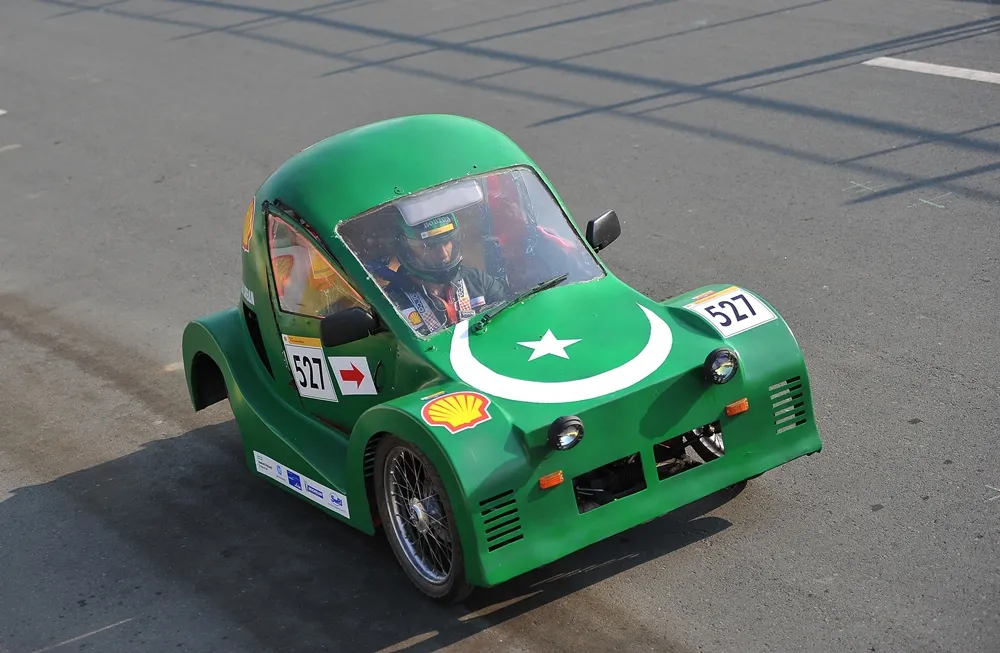 The Type One, #527, a gasoline UrbanConcept vehicle from Team Urban at the Ghulam Ishaq Khan Institute of Engineering Sciences and Technology in Topi, Pakistan, runs on the track during day three of the Shell Eco-marathon Asia in Manila, Philippines, Saturday, March 5, 2016. (Jinggo Montenejo  via AP Images)