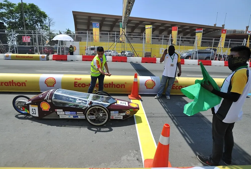 The EVE II, #53, a diesel prototype vehicle from team PUP-Hygears at the Polytechnic University of the Philippines - Manila in Manila, Philippines, enters the track during final day of the Shell Eco-marathon Asia, in Manila, Philippines, Sunday, March 6, 2016. (Geloy Concepcion/AP Images for Shell)