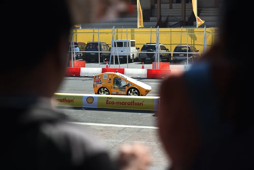 The TiP PiP GT,  #553, a CNG (Compressed Natural Gas) UrbanConcept vehicle from team TIP GTE Efficacy at the Technological Institute of the Philippines, Quezon City in Quezon City, Philippines, runs on the track during the final day of the Shell Eco-marathon Asia in Manila, Philippines, Sunday, March 6, 2016. (Jinggo Montenejo  via AP Images)