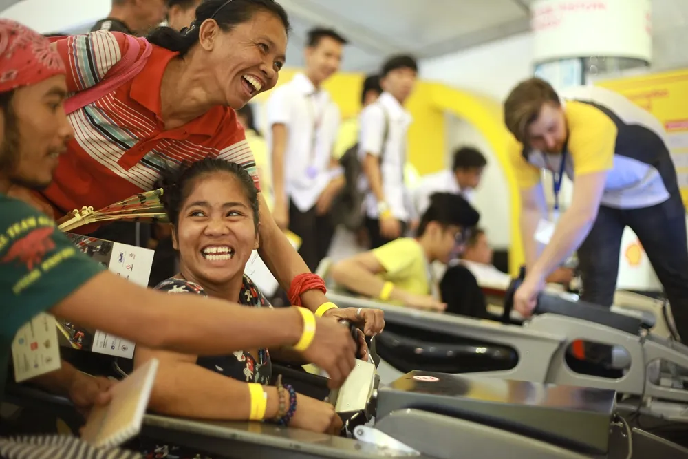 Guests play in one of the interactive displays at the energy lab during day one of the Shell Eco-marathon Asia in Manila, Philippines, Thursday, March 3, 2016. (Jake Verzosa/AP Images for Shell)