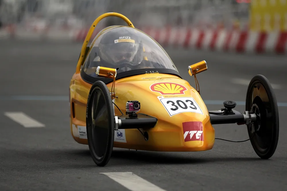 The EcoTraveller, #303, a battery electric prototype vehicle from team EcoTraveller at the Institute of Technical Education (ITE) in Singapore, runs on the track during day two of the Shell Eco-marathon Asia in Manila, Philippines, Friday, March 4, 2016. (Geloy Concepcion via AP Images)