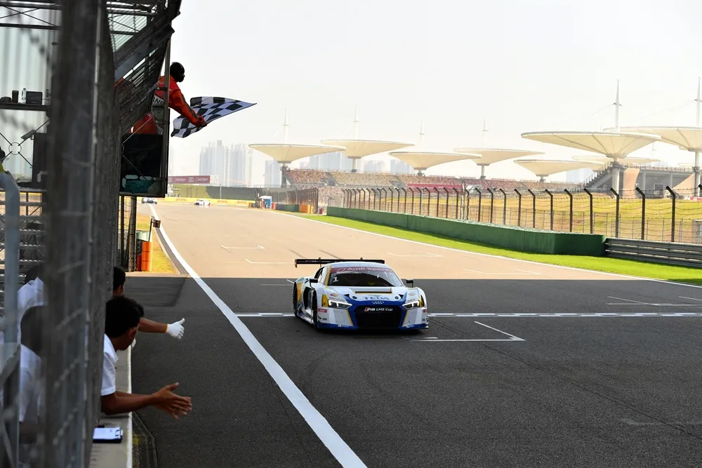 Alex Yoong (MAL) Audi TEDA Racing Team crosses the line & takes the flag for 2nd Position in Race1 at Audi R8 LMS Cup, Rd11 and Rd12, Shanghai International Circuit, Shanghai, China, 4-5 November 2016.